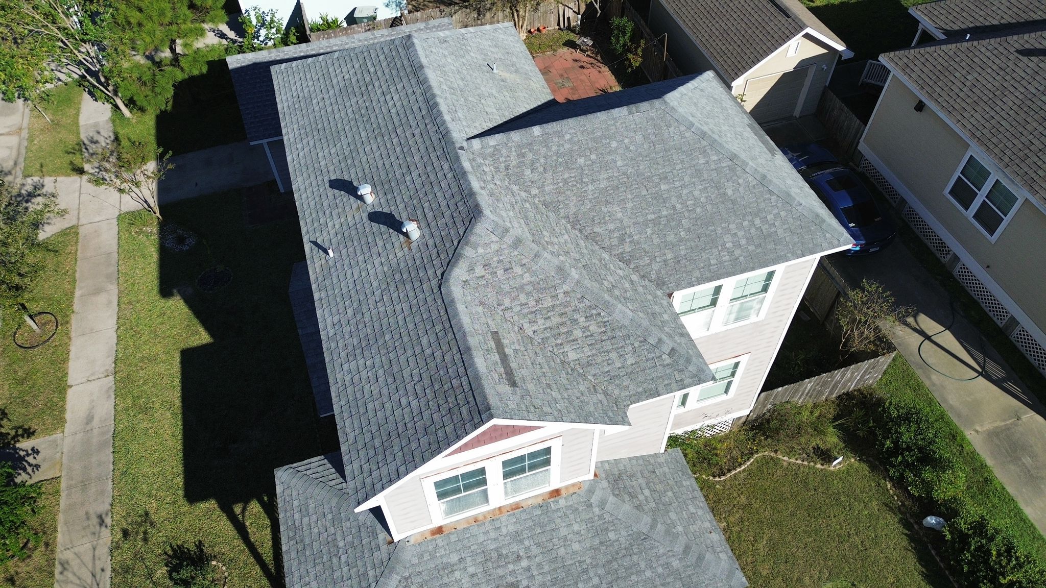 Installation process of asphalt shingles during Houston roofing project